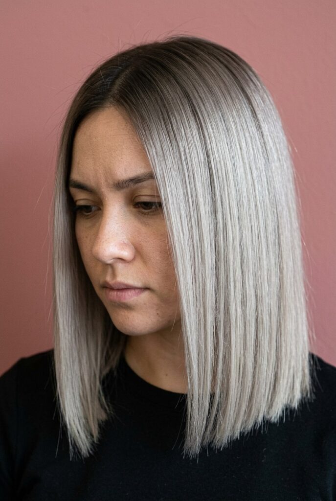 Woman with sleek blunt long haircut showing thick, straight bottom line