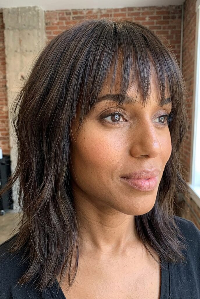 long layered shag face framing brunette shoulder length haircut 2026