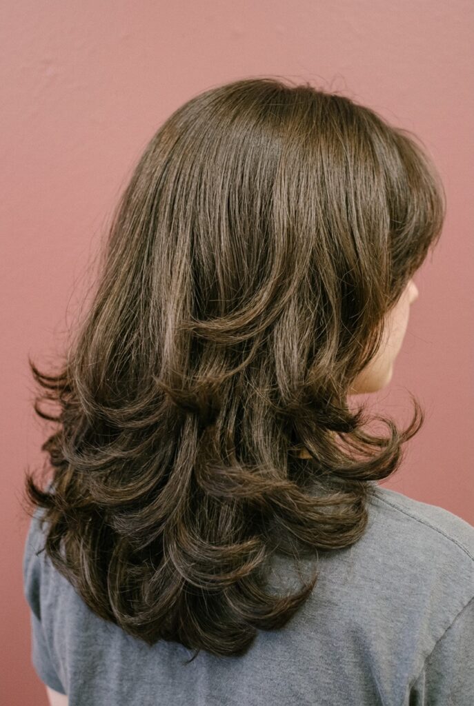 U-shaped long haircut with smooth rounded perimeter and full ends